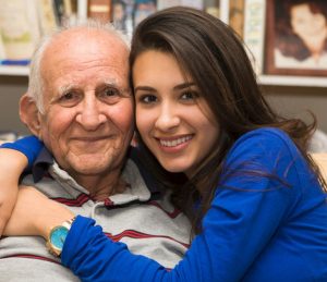 Support for families - image of elderly man with family member